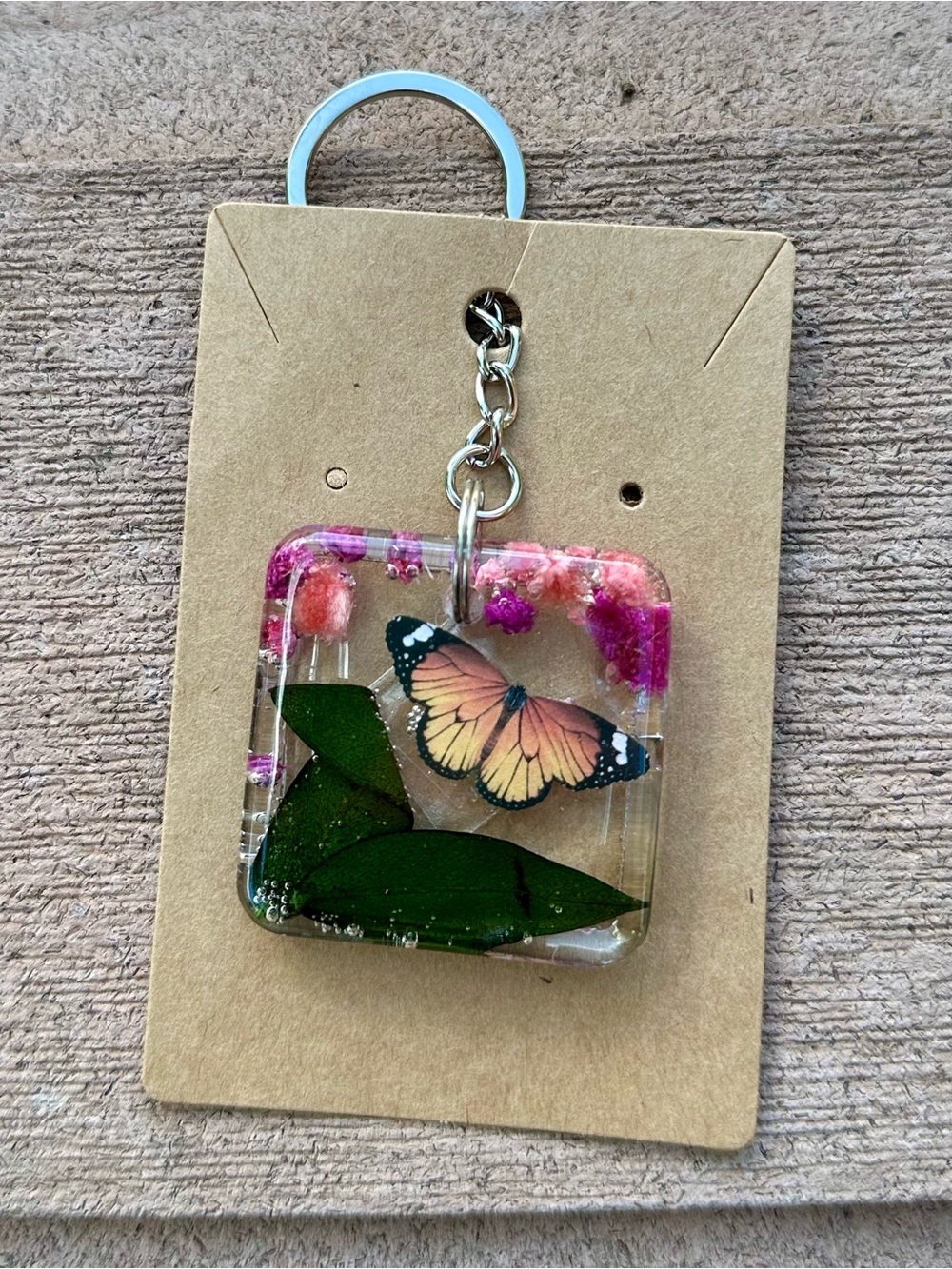 Pink Butterfly Resin Keychain with Green Leaf Accent